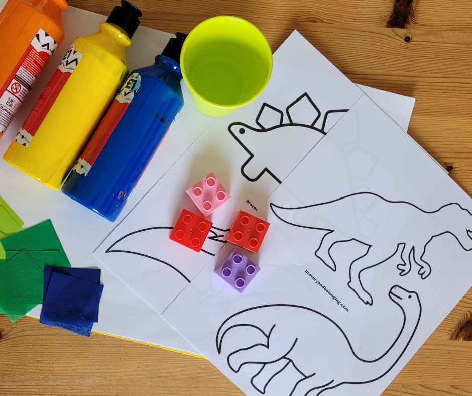 An image of the supplies needed to create your dinosaur art. There is a pot with a mix of glue and water in it, duplo blocks, colored tissue paper in greens and blues, my free dinosaur templates, and paint.