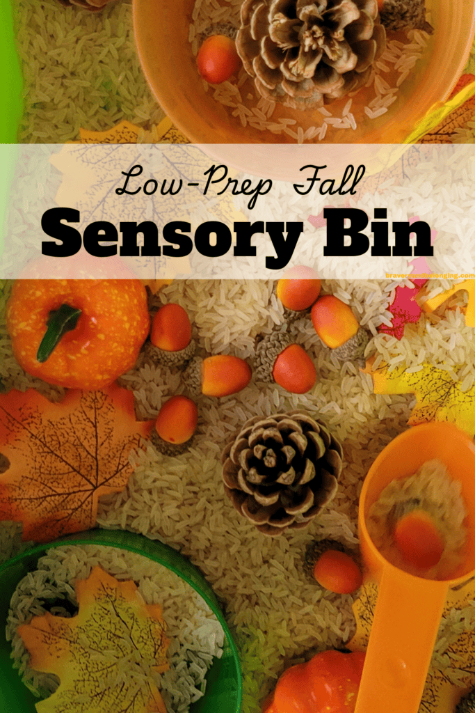 Pin text reads, low prep fall sensory bin and shows an image of a sensory bin filled with rice and fall items like fall leaves, acorns, pine cones and mini pumpkins.