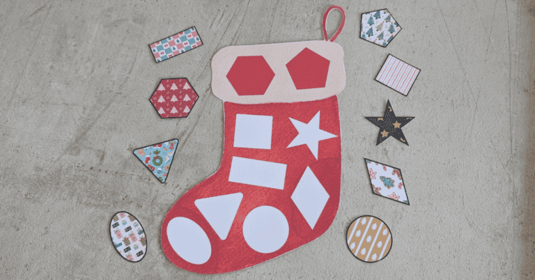 An image of my free santas stocking shape match printable in use.